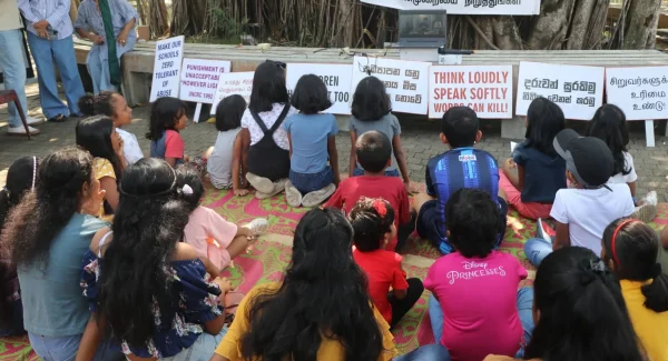 Children sitting together during a child protection awareness event